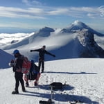 celebrating Iztaccihuatl summit with Popocateptl volcano behind