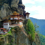 Taktsang Lhakhang is Bhutan’s most iconic landmark and religious site. The name Taktsang translates to “The Tiger’s Nest”. This temple is one of the most holy sites in the kingdom and clings impossibly to a sheer cliff face 900 hundred meters above .