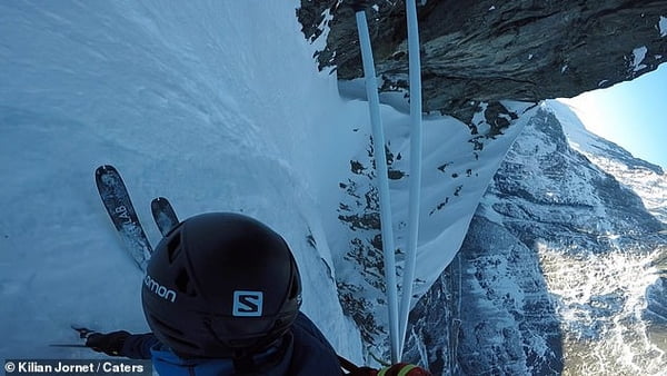 Daredevil skis down Europe’s tallest 'vertical' rock face