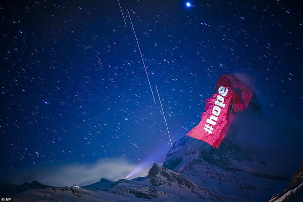Matterhorn mountain is lit up with 'stay home' message 